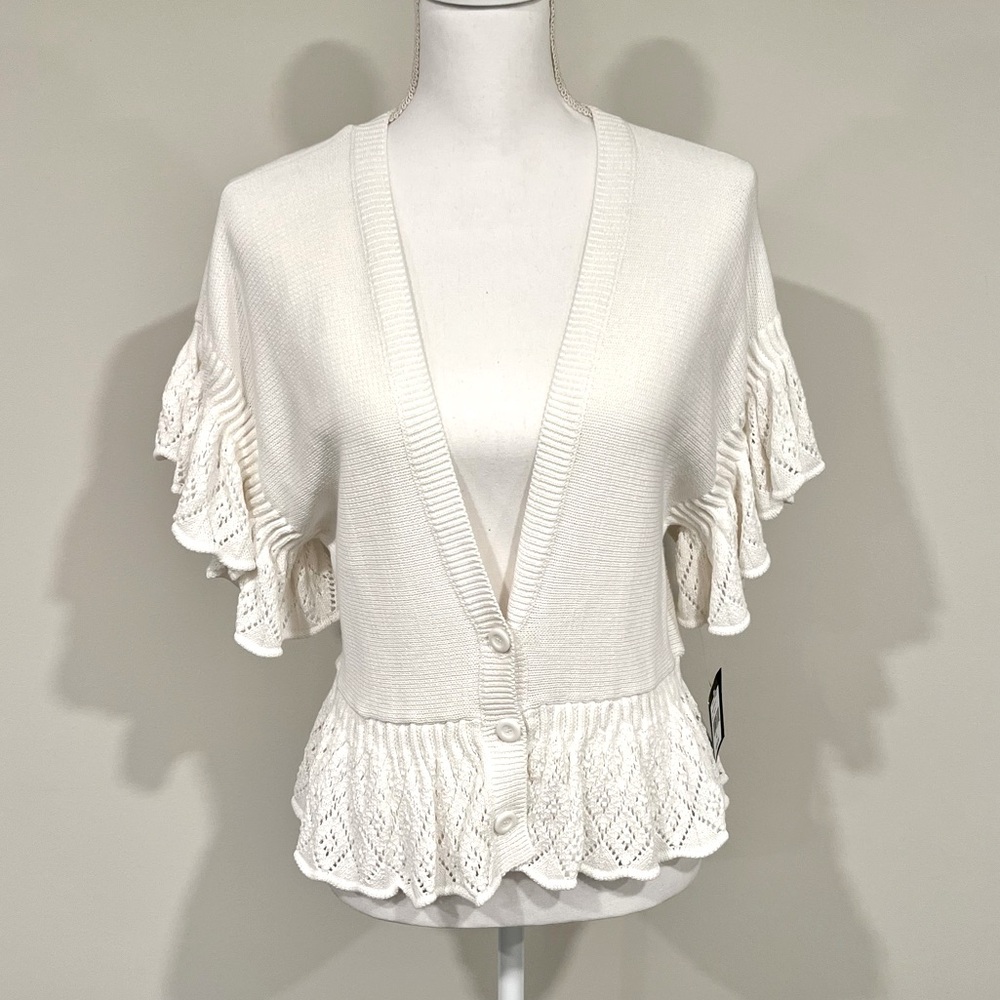 NWT. Nanette lepore white cotton sweater with knit ruffle detailing. Size L.